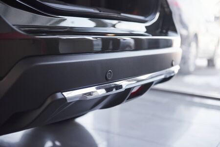 Rear part. Modern brand new black car in the saloon. Ready for the sale. Perfectly polished.の写真素材