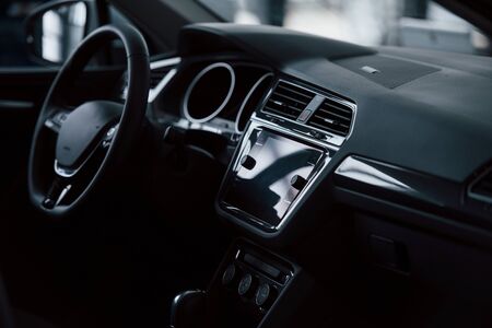 Front part of brand new automobile. Modern black interior. Conception of vehicles.の写真素材
