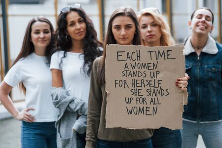 Peaceful protest. Group of feminist women have demonstration for their rights outdoors.の写真素材