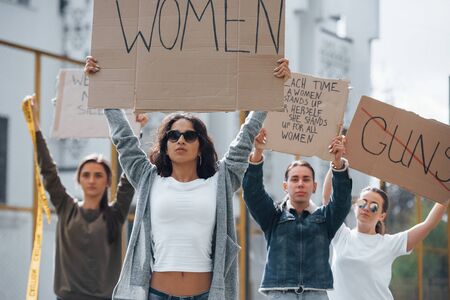 Walking forward. Group of feminist women have protest for their rights outdoors.の写真素材