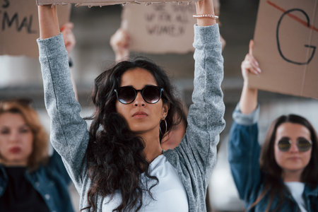 Luxury sunglasses. Group of feminist women have protest for their rights outdoors.の写真素材
