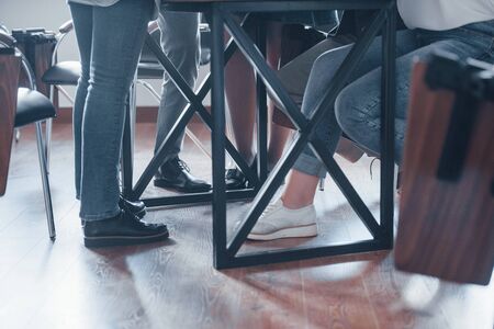 Grounded view. Group of people at business conference in modern classroom at daytime.の写真素材