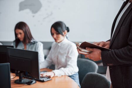 Preparing reports. Business people and manager working on their new project in classroom.の写真素材