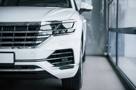 Particle view of modern luxury white car parked indoors at daytime.の写真素材