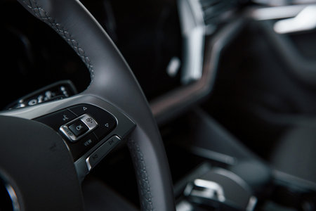 Buttons for turn lights and more. Close up view of interior of brand new modern luxury automobile.