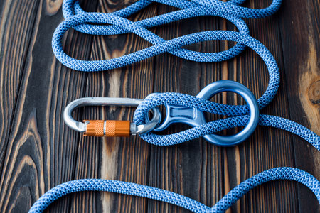 To the peak of the hill. Isolated photo of climbing equipment. Parts of carabiners lying on the...