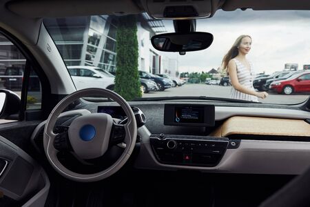 Inside of brand new modern electrical car. Particle view. Cropped photo.の写真素材