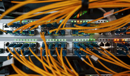 Close up view of internet equipment and cables in the server room.の写真素材