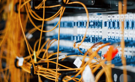 Close up view of internet equipment and cables in the server room.の写真素材