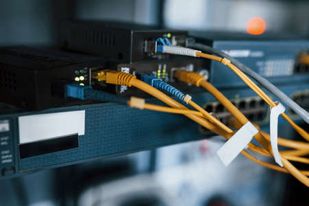 Close up view of internet equipment and cables in the server room.の写真素材
