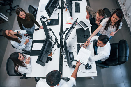 Group of young business people that working by computers in the modern office.の写真素材