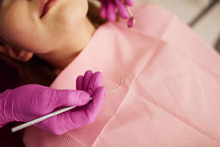 Little girl visiting dentist in clinic. Conception of stomatology.の写真素材