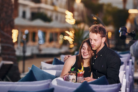 Closeness of the people. Happy young couple is together on their vacation. Outdoors at sunny daytime