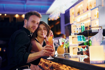 At the bar. Happy young couple is together on their vacationの写真素材