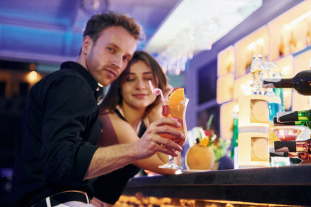 At the bar. Happy young couple is together on their vacationの写真素材