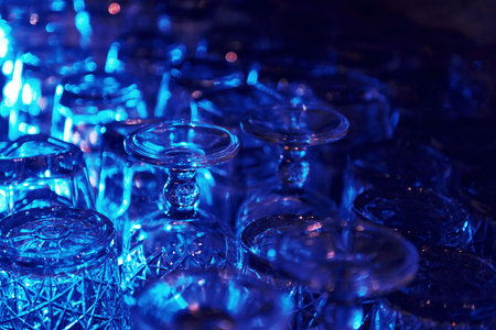 Close up view of row of empty glasses on table in the pub indoorsの写真素材