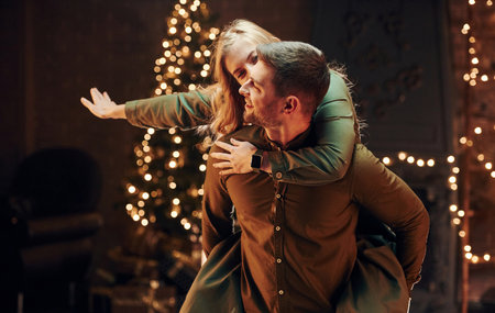 Having fun. Young lovely couple have romantic dinner indoors togetherの写真素材