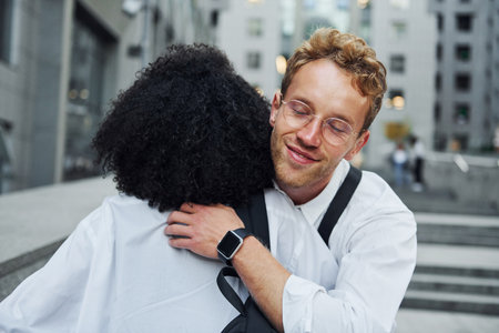 Nice meet. Man with afrian american woman together in the city outdoorsの写真素材