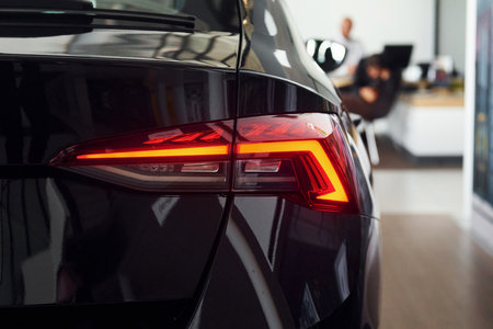 Rear view of the car. Close up focused view of brand new modern black automobileの写真素材