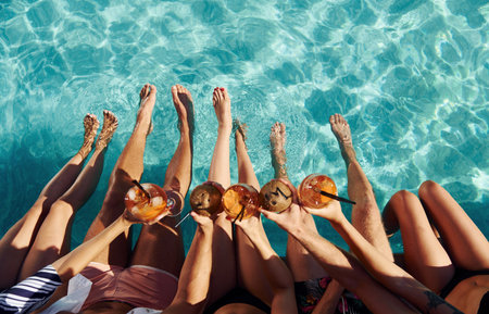 Top view of group of young happy people that have fun in swimming pool at daytimeの写真素材