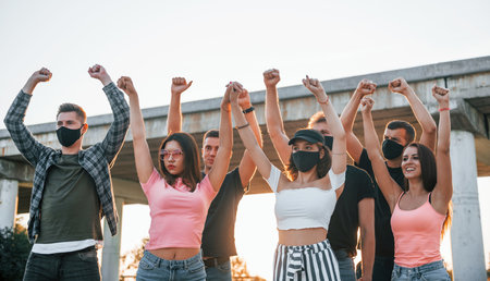 Group of protesting young people that standing together. Activist for human rights or against governmentの写真素材