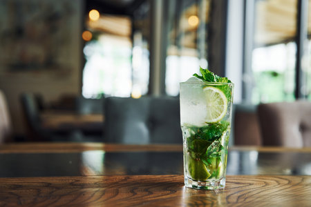 Close up view of fresh summer non alcoholic mojito cocktail on the wooden tableの写真素材