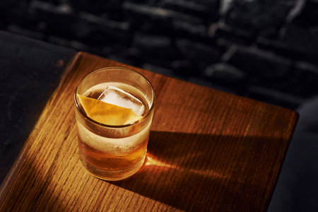 Ice cubes inside. Close up view of fresh summer cocktail on the wooden tableの写真素材