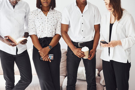 Group of african american business people near sofa in office togetherの写真素材