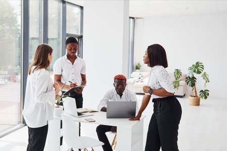 Paper work. Group of african american business people have job in office togetherの写真素材