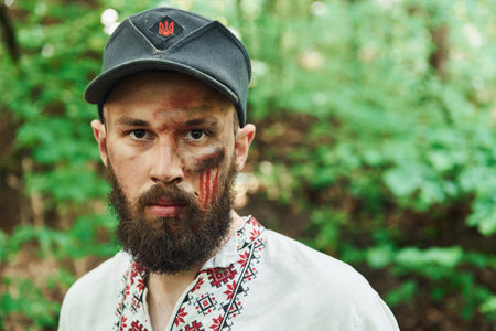 TERNOPIL, UKRAINE - June 2020 UPA Ukrainian Insurgent Army movie filming. Pictures of backstage. Young man with blood on faceのeditorial素材