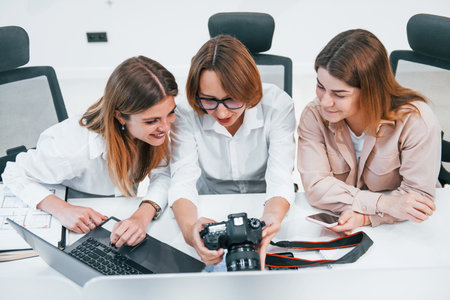 Front view of group of business people in formal clothes working indoors in the officeの写真素材