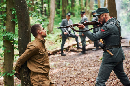 TERNOPIL, UKRAINE - June 2020 UPA Ukrainian Insurgent Army movie filming. Pictures of backstage. Interrogation of the hostage that tied to the treeのeditorial素材