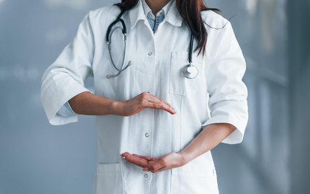Close up view of young nurse that indoors in modern clinic. Conception of healthcareの写真素材