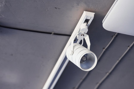 Interior of modern kitchen with light bulbs hanging indoors at daytimeの写真素材