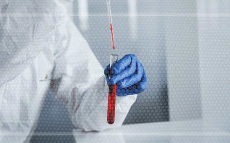 Digital world map on picture. Male doctor scientist in lab coat standing indoors with blood test tubeの写真素材