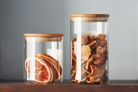 Glasses with dry products standing on the table indoors in kitchenの写真素材