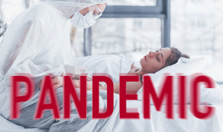 Nurse in medical protective wear taking care of sick patientの写真素材