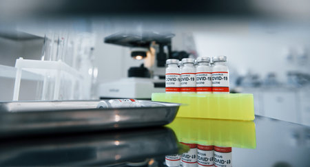 Close up view of COVID-19 vaccine in test tubes in the laboratoryの写真素材