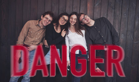 Group of cheerful friends standing together at pandemic time. Conception of coronavirusの写真素材