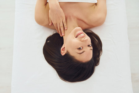 Close up view of woman that lying down on the couchの写真素材