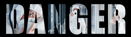 Nurse in protective uniform, mask and glasses standing indoorsの写真素材