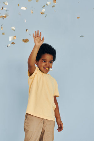 Happy little african american kid have fun indoors at birthday party