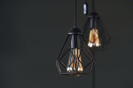 Modern designed light bulbs hangs on the wall indoors. Decoration and domestic lifeの写真素材