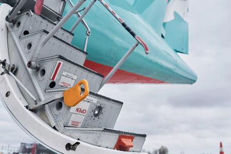 Doors is open. Turboprop aircraft parked on the runway at daytimeの写真素材