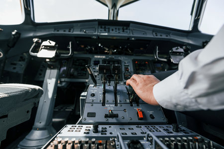 Pilot on the work in the passenger airplane. Preparing for takeoffの写真素材