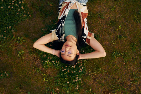 Top view. Young asian woman is outdoors at daytimeの写真素材