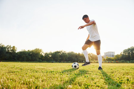 One person only. Young soccer player have training on the sportive fieldの写真素材