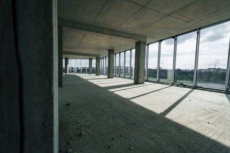 Indoors in the unfinished building. Conception of construction