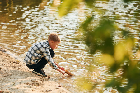Boy in casual clothes in on fishion outdoors at summertimeの写真素材