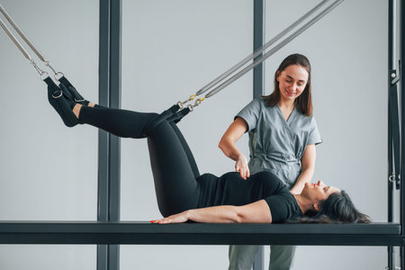Woman is in health center getting help by doctor.の写真素材